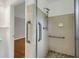 Bathroom shower with grab bars, tiled walls, and mosaic-tiled shower floor at 4102 Barr Cir, Tucker, GA 30084