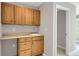 Utility room with wooden cabinets, a sink, and a doorway leading to another room at 4102 Barr Cir, Tucker, GA 30084
