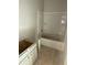 Unfinished bathroom showcasing a tub and shower combo and a white cabinet at 543 Courthouse Park Dr, Temple, GA 30179
