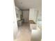 An incomplete kitchen features modern gray cabinets and a spacious layout, ready for customization and finishing touches at 543 Courthouse Park Dr, Temple, GA 30179