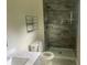 Modern bathroom with a sleek walk-in shower, updated vanity, and well-placed shelving at 841 N North Price Rd, Sugar Hill, GA 30518