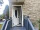 Inviting home entrance with an oval-glass door and stone veneer walls at 841 N North Price Rd, Sugar Hill, GA 30518