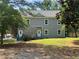 Inviting two-story home with a gray exterior, complemented by stone accents and a well-maintained lawn at 841 N North Price Rd, Sugar Hill, GA 30518