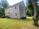 Exterior of a gray two-story home with a well-maintained lawn at 841 N North Price Rd, Sugar Hill, GA 30518