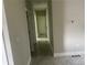 Hallway with updated tile floors leading to the other rooms in the house, and neutral paint at 841 N North Price Rd, Sugar Hill, GA 30518