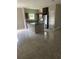 Open kitchen features an island, tile floor, and stainless steel appliances at 841 N North Price Rd, Sugar Hill, GA 30518