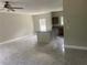 Living room and kitchen boasts tile floors and a center island with countertops at 841 N North Price Rd, Sugar Hill, GA 30518