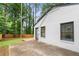 Exterior view of the home with a deck, fenced yard, and mature trees at 1719 San Gabriel Ave, Decatur, GA 30032