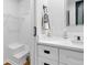 Bathroom features walk-in closet, bright lighting, and modern vanity with black fixtures at 1719 San Gabriel Ave, Decatur, GA 30032