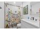 Stylish bathroom featuring a floral shower curtain, modern sink, and decorative art at 1719 San Gabriel Ave, Decatur, GA 30032