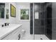 Updated bathroom showcases a glass enclosed shower with black marble tile and modern fixtures at 1719 San Gabriel Ave, Decatur, GA 30032