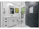Beautiful bathroom features stylish marble shower, floating vanity, modern fixtures, and herringbone flooring at 1719 San Gabriel Ave, Decatur, GA 30032