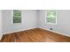 Bright bedroom with hardwood floors and large windows, providing ample natural light at 1719 San Gabriel Ave, Decatur, GA 30032