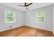 Well-lit bedroom featuring hardwood floors and two windows, creating a comfortable living space at 1719 San Gabriel Ave, Decatur, GA 30032