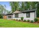 Inviting home featuring a brick facade, large windows, green lawn, and tasteful landscaping at 1719 San Gabriel Ave, Decatur, GA 30032