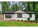 Charming home boasts freshly painted exterior, large windows, green lawn, and tasteful landscaping at 1719 San Gabriel Ave, Decatur, GA 30032