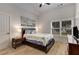 Cozy bedroom with a queen-sized bed, modern decor, and natural light at 4960 Iris St, Cumming, GA 30040