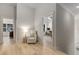 Hallway featuring hardwood floors and neutral walls at 4960 Iris St, Cumming, GA 30040