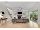 Bright and open living room with hardwood floors, fireplace, and sliding doors to the patio at 4960 Iris St, Cumming, GA 30040