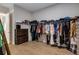Walk-in closet with extensive hanging space and shelving for organized storage at 4960 Iris St, Cumming, GA 30040