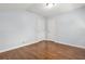 Clean bedroom featuring hardwood floors, neutral walls, ceiling light and two closet doors at 4981 Crowe Se Dr, Smyrna, GA 30082