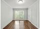 Bedroom featuring wood floors, light blue walls, a double window and a closet at 4981 Crowe Se Dr, Smyrna, GA 30082