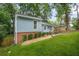 Charming exterior showcasing a well-kept lawn and classic architectural details at 4981 Crowe Se Dr, Smyrna, GA 30082