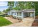 Inviting home exterior showcasing a covered parking and tasteful landscaping at 4981 Crowe Se Dr, Smyrna, GA 30082