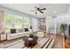Bright living room with hardwood floors, large windows, and stylish decor at 4981 Crowe Se Dr, Smyrna, GA 30082