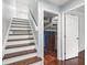 Basement staircase featuring hardwood steps with an adjacent door at 4981 Crowe Se Dr, Smyrna, GA 30082