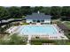 Aerial view of a large community pool with lounge seating and landscaping at 6765 Creek View Ln, Cumming, GA 30041