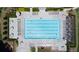 A beautiful swimming pool with ample seating, surrounded by manicured landscaping at 6765 Creek View Ln, Cumming, GA 30041