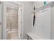 Entryway with a convenient mudroom area with storage and a bench, connected to a stylish bathroom with a glass-door shower at 830 Stone Ridge Ln, Atlanta, GA 30324