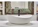 Close-up of a vessel sink atop a marble countertop in a renovated bathroom at 1101 Juniper Ne St # 922, Atlanta, GA 30309