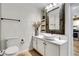 Elegant bathroom featuring a vessel sink, rustic mirror and bright lighting at 1101 Juniper Ne St # 922, Atlanta, GA 30309