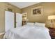 Bedroom with a view of the kitchen, hardwood floors, and comfortable bed at 1101 Juniper Ne St # 922, Atlanta, GA 30309