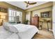 Bright bedroom with hardwood floors, a ceiling fan, and natural light from a window at 1101 Juniper Ne St # 922, Atlanta, GA 30309
