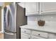 Modern kitchen with stainless steel appliances, quartz countertops, and white cabinetry at 1101 Juniper Ne St # 922, Atlanta, GA 30309