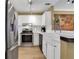 Kitchen boasts stainless steel appliances, white cabinets, and stylish backsplash at 1101 Juniper Ne St # 922, Atlanta, GA 30309