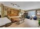 Bright living room with wood-style flooring, large painting, and comfortable seating at 1101 Juniper Ne St # 922, Atlanta, GA 30309
