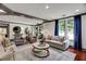Spacious lounge area with sofas, chairs, and large windows, providing a comfortable place to relax and socialize at 1101 Juniper Ne St # 922, Atlanta, GA 30309