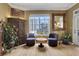 Relaxing sitting area with comfortable chairs, a view, hardwood floors, and decorative accents at 1101 Juniper Ne St # 922, Atlanta, GA 30309