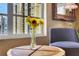 Corner of the comfortable sitting area showing wood table, chairs, and bright window at 1101 Juniper Ne St # 922, Atlanta, GA 30309