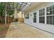 Relaxing back patio with pergola, outdoor table, and direct access to the home at 112 Rotherhithe Nw Ln, Marietta, GA 30066