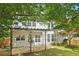 Expansive backyard featuring a covered patio and well-maintained landscaping at 112 Rotherhithe Nw Ln, Marietta, GA 30066