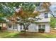 Spacious backyard view showcases the home's exterior and landscaped garden area at 112 Rotherhithe Nw Ln, Marietta, GA 30066