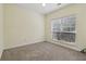 Light-filled bedroom with neutral carpet, ideal for relaxation and personalization at 112 Rotherhithe Nw Ln, Marietta, GA 30066