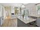 Updated kitchen with gray cabinets, granite island, and a view to the Gathering room at 112 Rotherhithe Nw Ln, Marietta, GA 30066