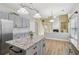 Stylish kitchen with granite countertops, gray cabinets, and stainless steel appliances at 112 Rotherhithe Nw Ln, Marietta, GA 30066