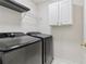 Well-equipped laundry room with modern washer and dryer units for convenient chores at 112 Rotherhithe Nw Ln, Marietta, GA 30066